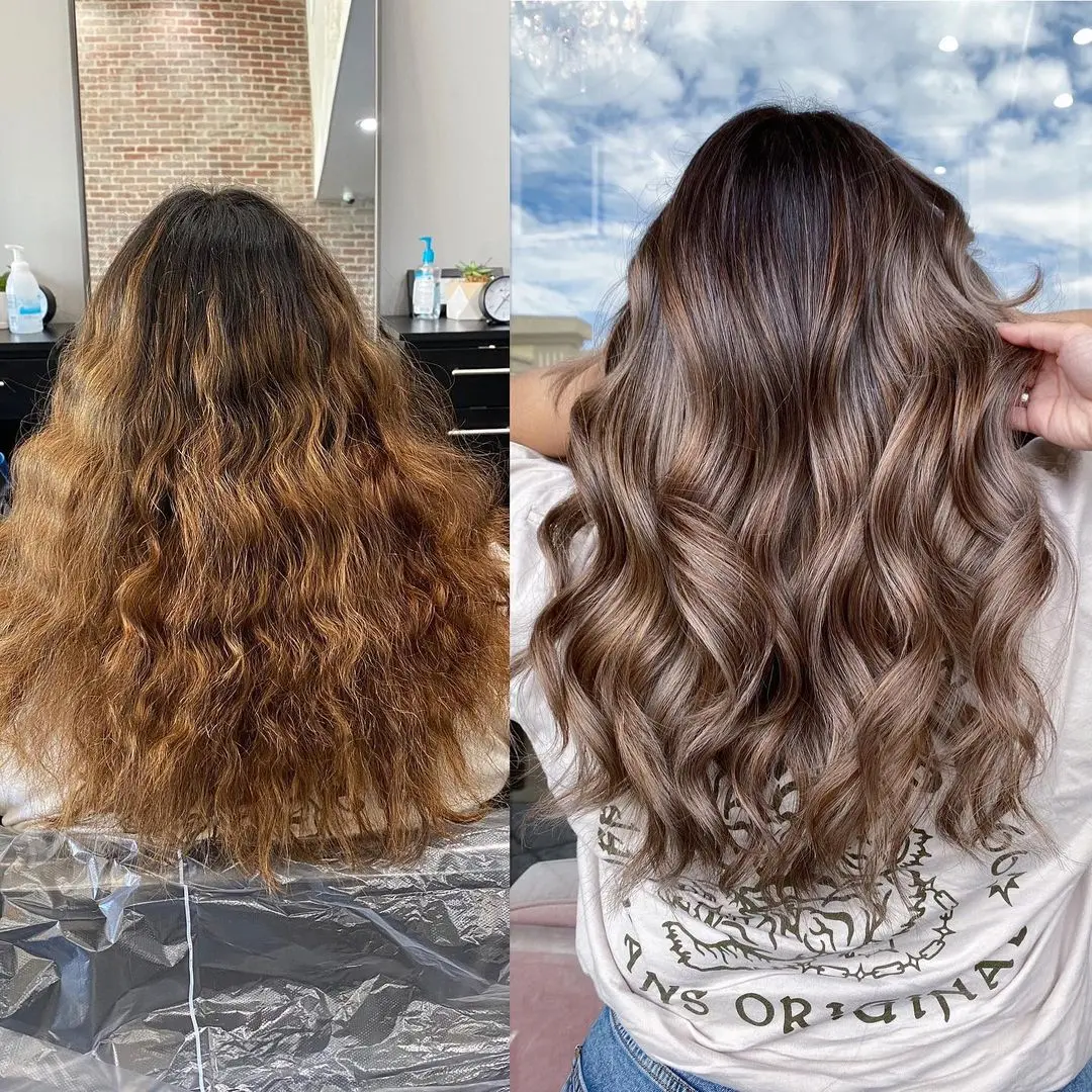 A hairdresser or hair stylist who is performing a color service at CANVAS Salon